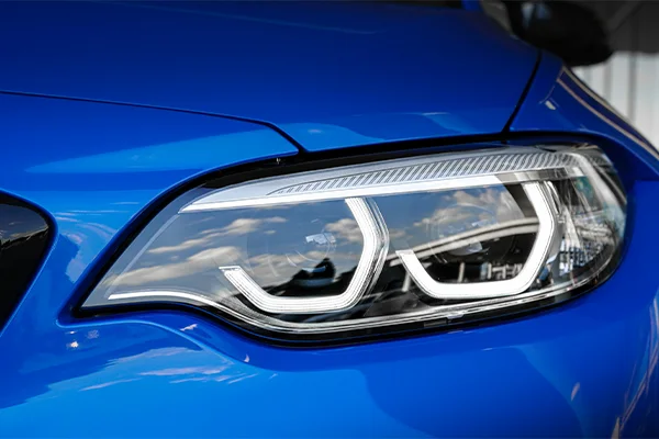 LED headlight of blue BMW