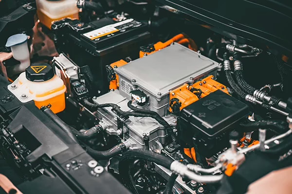 Engine bay of hybrid vehicle showing motor and electrical components