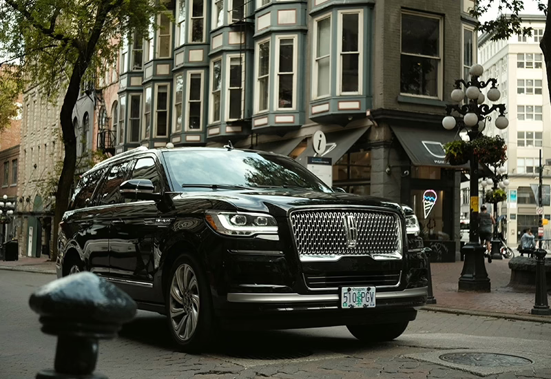 Black Lincoln driving